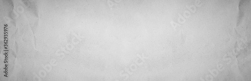 Table top back panoramic gray line draw paper kraft background texture in soft white light color concept for page wide screen wallpaper design, flat rice grey surface for panoramic wall. plain cement