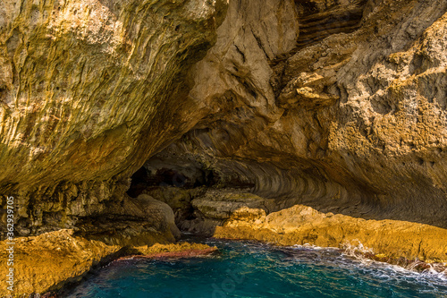 Fototapeta Naklejka Na Ścianę i Meble -  A wavecut notch marks the base of the White Grotto on the Island of Capri, Italy