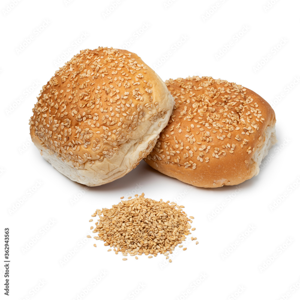 Fresh baked buns with sesame seed and a heap of sesame seed