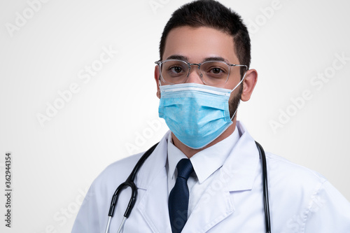 Man doctor wearing medical anti virus mask, doctor or scientist in protective facial mask over white background, medicine, profession and healthcare concept.