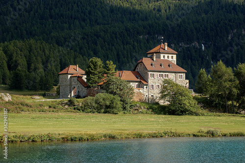 Ancient Castle Crap da Sass, on the coast of the Silvaplana Lake (Silvaplanersee), Silvaplana village, Saint Moritz. Engadin valley, Graubunden canton, Maloja region, Switzerland, Europe