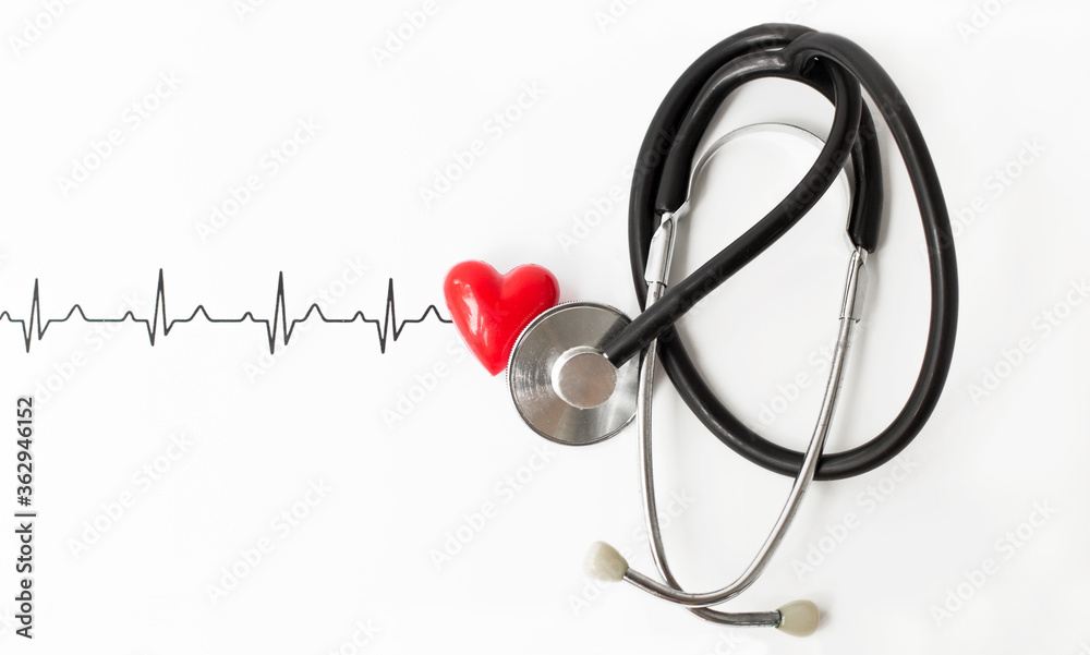 Examine the heart to prevent heart disease. Heart sign, cardiogram, stethoscope on white background top view Examine the heart to prevent heart disease. Heart sign, cardiogram, stethoscope on white background top view