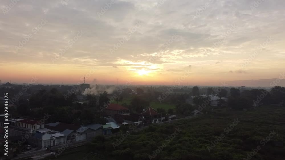aerial view of the sun rising in the rural areas of Bantul Yogyakarta aerial view of the sun rising in the rural areas of Bantul Yogyakarta