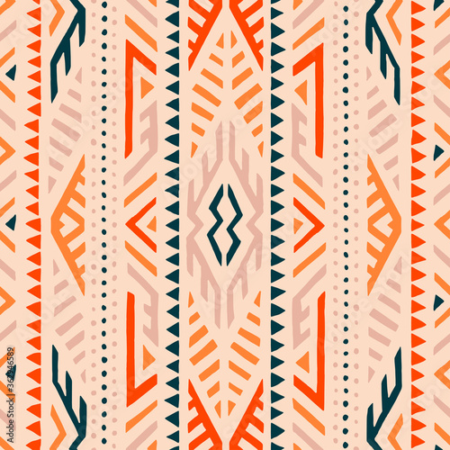Seamless ethnic pattern. Tribal and aztec motifs. Bohemian ornament for textiles, home decor, summer dresses. Geometric background. Vector illustration.