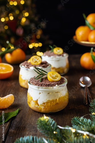 Homemade christmas dessert, no bake cheesecake with tangerines and chocolate