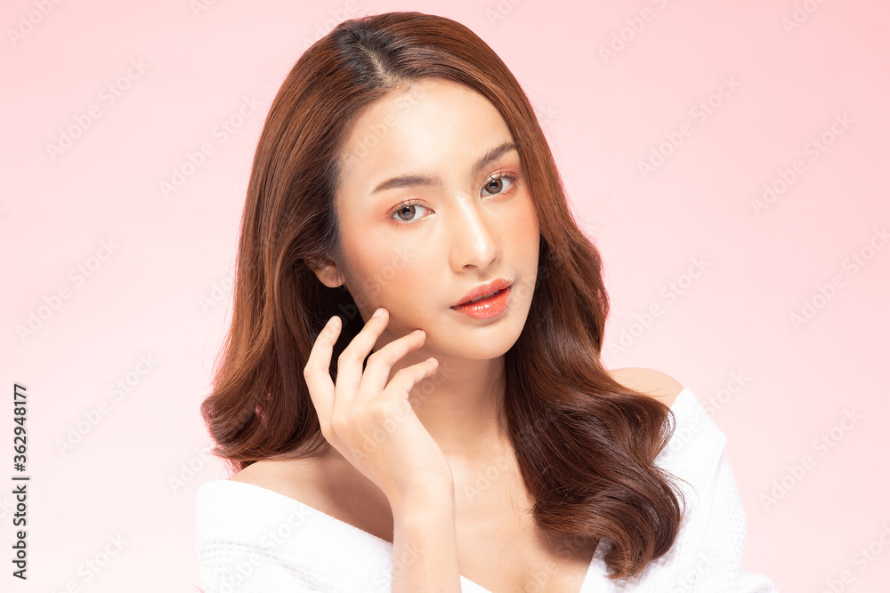 Beautiful Asian woman touching soft cheek smile with clean fresh skin Beautiful Asian woman touching soft cheek smile with clean fresh skin