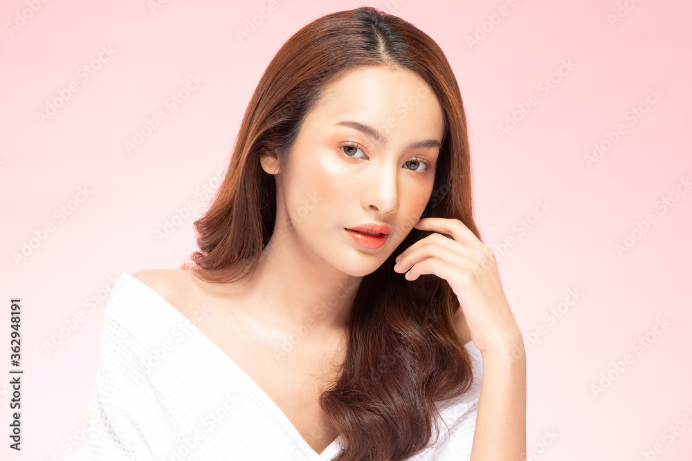 Beautiful Asian woman touching soft cheek smile with clean fresh skin Beautiful Asian woman touching soft cheek smile with clean fresh skin