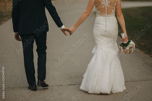 bride and groom walking in autumn