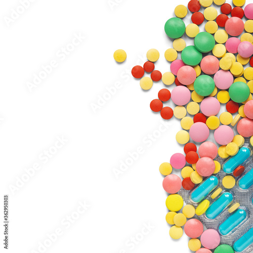 pile of medical pills on white background with place for text. Pattern for design.