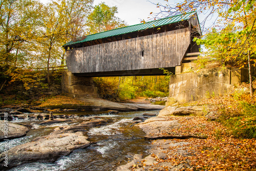 The Montgomery Covered Bridge, also known as the Lower Covered Bridge is a wooden covered bridge that carries Montgomery Road across the North Branch of the Lamoille River in Waterville, Vermont photo