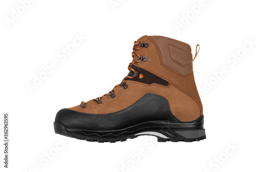 Modern mountain boots isolate on a white back. Shoes for outdoor activities and travel.