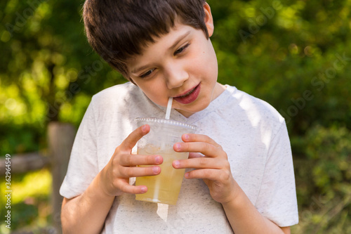 A boy drinking lemonade