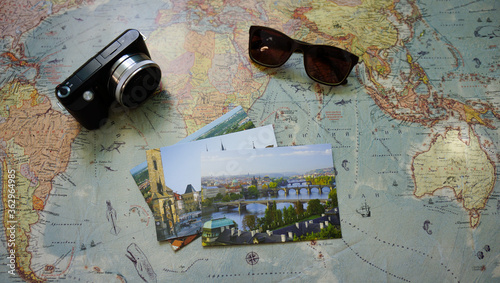 Travel concept: map, camera, sunglasses, stamps