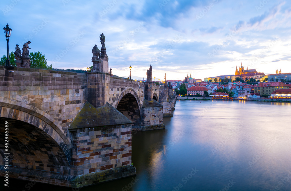 Charles Bridge and Hradczany in Old Town of Prague during dusk in Czech Republic