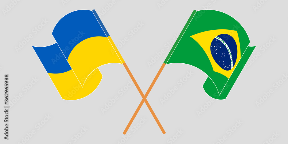 Crossed and waving flags of the Ukraine and Brazil Crossed and waving flags of the Ukraine and Brazil