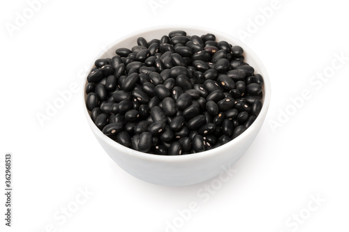 Bowl with black beans isolated on white background