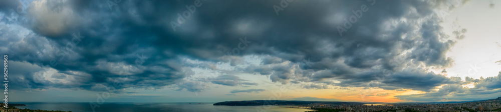 Panoramic view of stormy cloudy sky over the sea.