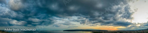 Panoramic view of stormy cloudy sky over the sea.