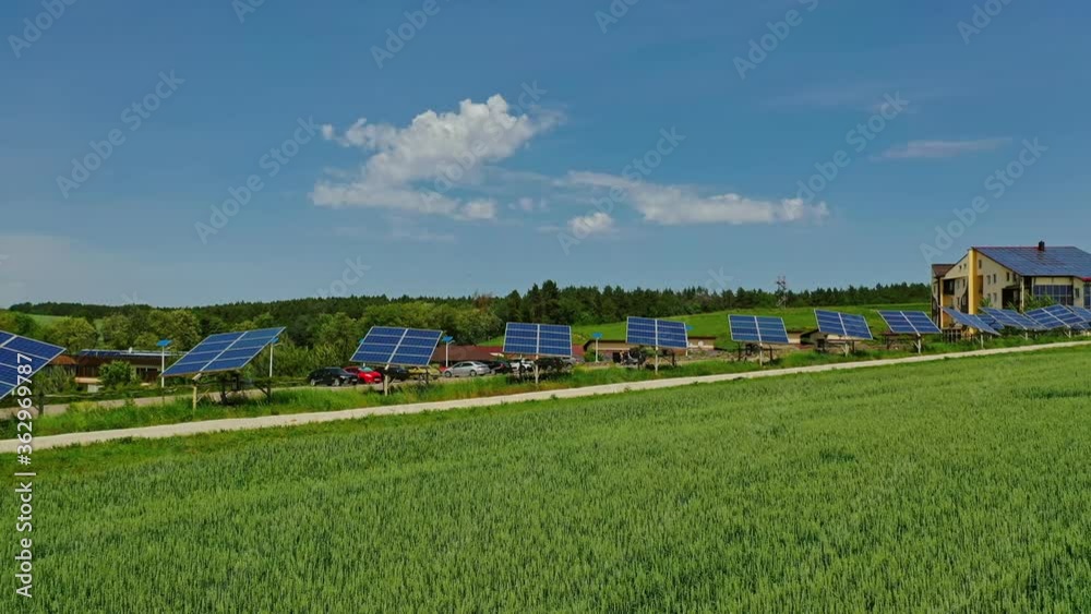 Sunny batteries on green field. Solar panels along the road in the countryside. Renewable source of clean energy. Sunny batteries on green field. Solar panels along the road in the countryside. Renewable source of clean energy.