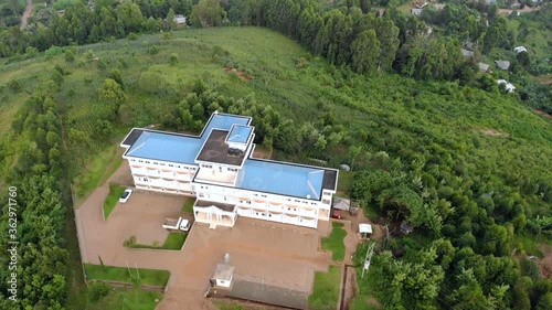 Aerial Flyby Shot of Lushoto Town based in Lush Mountain Tropical Forest in Tanga Region of Tanzania, Remote calm district in Usambara Mountains in East Africa photo