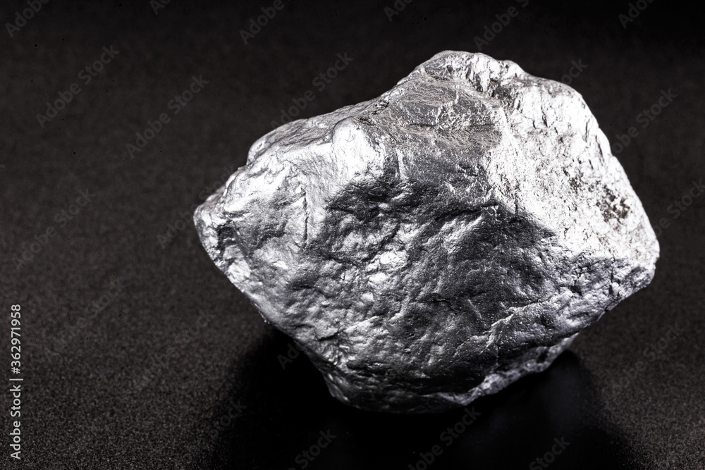 silver nugget native to Liberia isolated on black background. Rare stone for industrial extraction ore