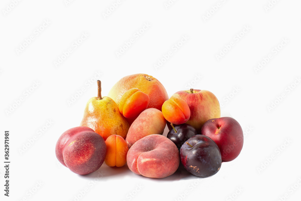 Fruits assortment isolated on white background. Pear, apple, grapefruit, apricots, peaches and plums Fruits assortment isolated on white background. Pear, apple, grapefruit, apricots, peaches and plums