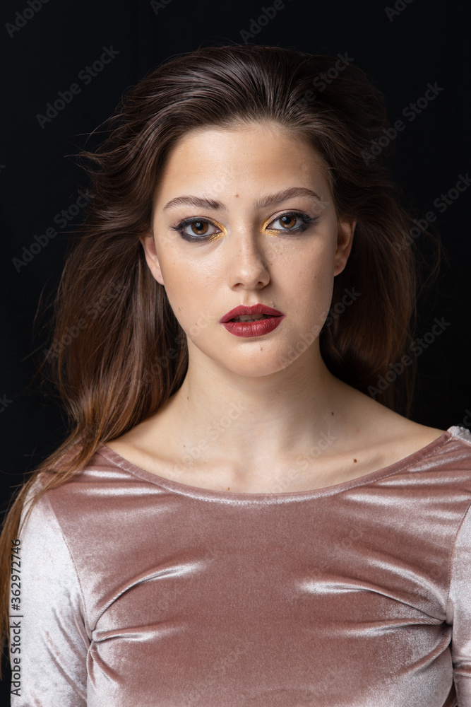 Beauty portrait of a girl with makeup with red lips Beauty portrait of a girl with makeup with red lips