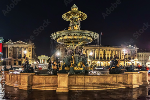 Fontaines de la Concorde (designed by Jacques Ignace Hittorff, 1840) at night on Place Concorde in Paris, France. North fountain commemorates navigation and commerce on rivers of France.