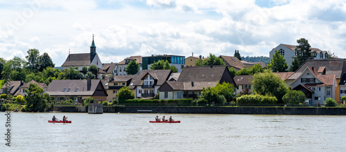 people on canoes paddle down the Rhine River near Sisseln in northern Switzerland photo