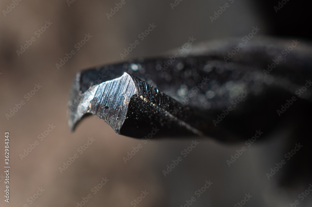 Sharp sharpened end of a drill close-up, macro shot Sharp sharpened end of a drill close-up, macro shot