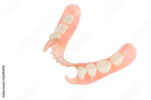 Removable plastic partial denture on white background