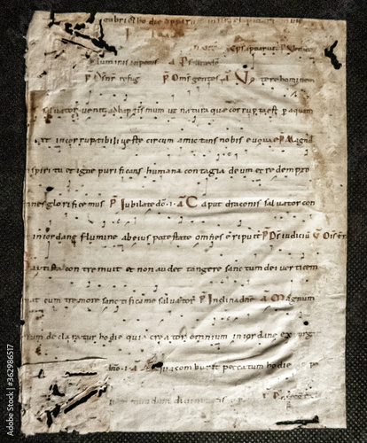 Tenth century leaf on vellum of a Missal or Lectionary with early musical notation neumes 