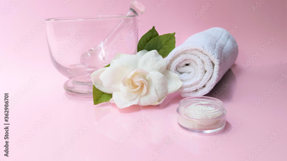 Spa setting and Spa background composition with white gardenia flower on pink background. Banner Spa setting and Spa background composition with white gardenia flower on pink background. Banner