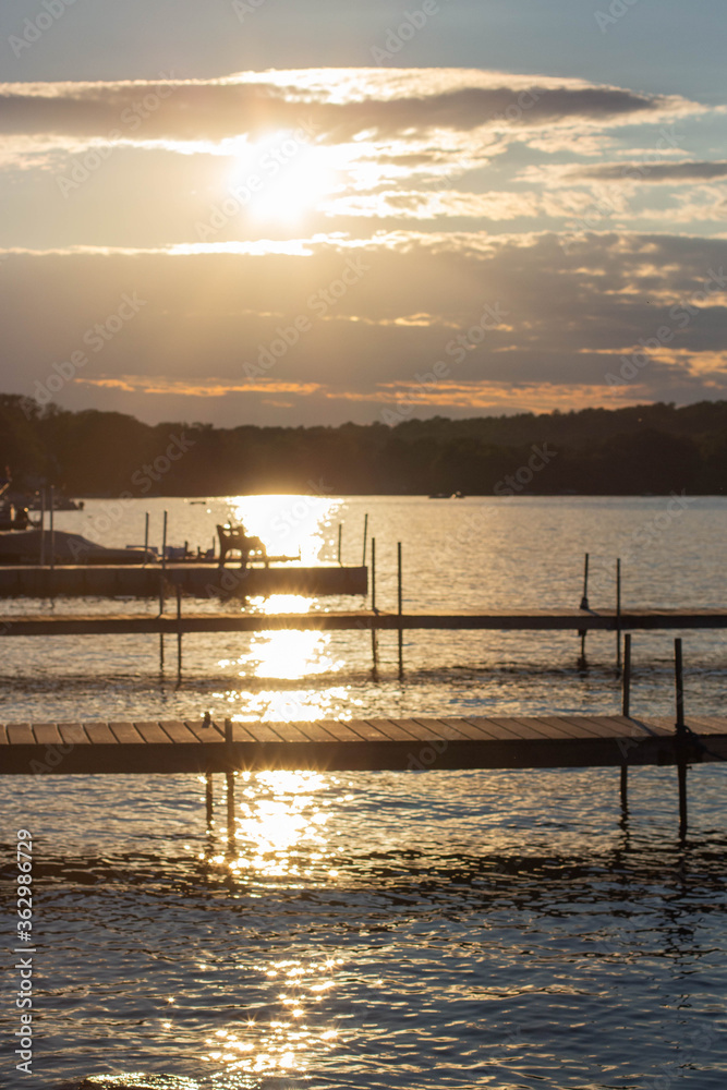 golden hour over docks on lake