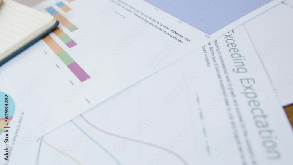 Close Up Business Charts and Analysis on Desk Close Up Business Charts and Analysis on Desk