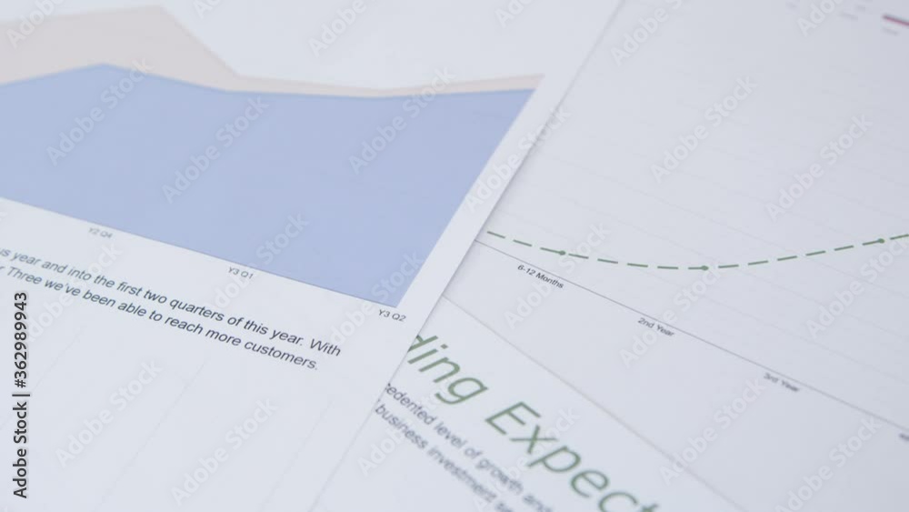 Close Up Business Reports and Analysis on Desk Close Up Business Reports and Analysis on Desk