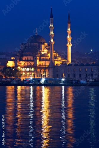 Night scene over the New Mosque known also as Yeni Cami, at the twilight, in Istanbul, Turkey.