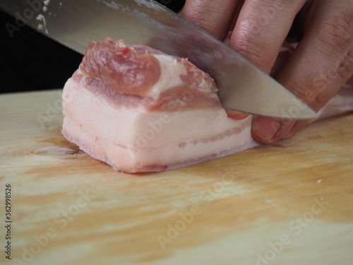 sliced pork belly on a wooden Board.