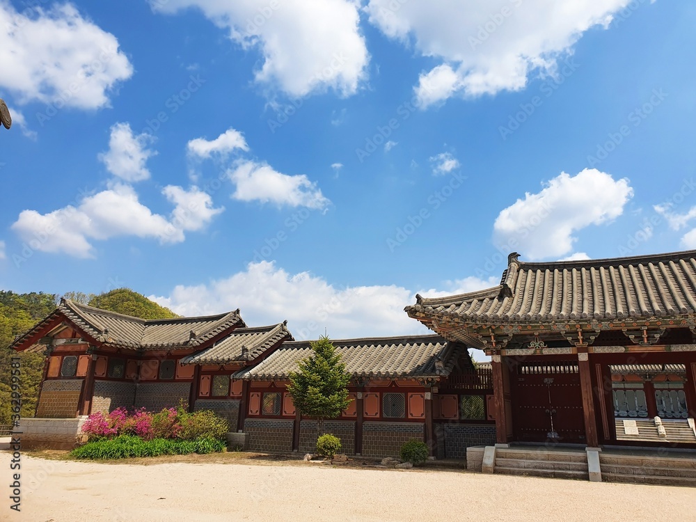 Traditional Korean buildings under a blue sky at daytime Traditional Korean buildings under a blue sky at daytime