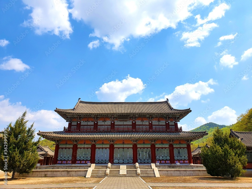 Traditional Korean palace under a blue sky at daytime Traditional Korean palace under a blue sky at daytime