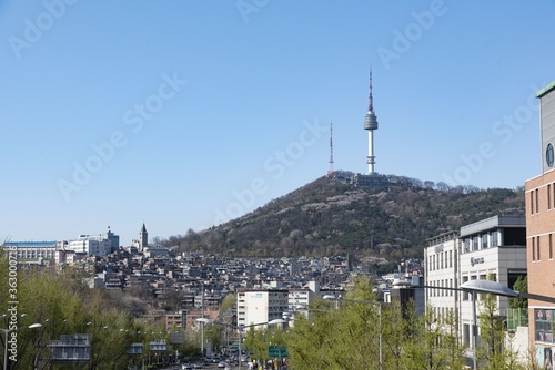 SEOUL, KOREA, SOUTH - Jul 28, 2018: Busy street in Seoul. South Korea with a radio tower visible on the hills in the background