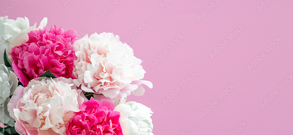 Bouquet beautiful flowers on pink background. Universal greeting card. FLatlay with pionies