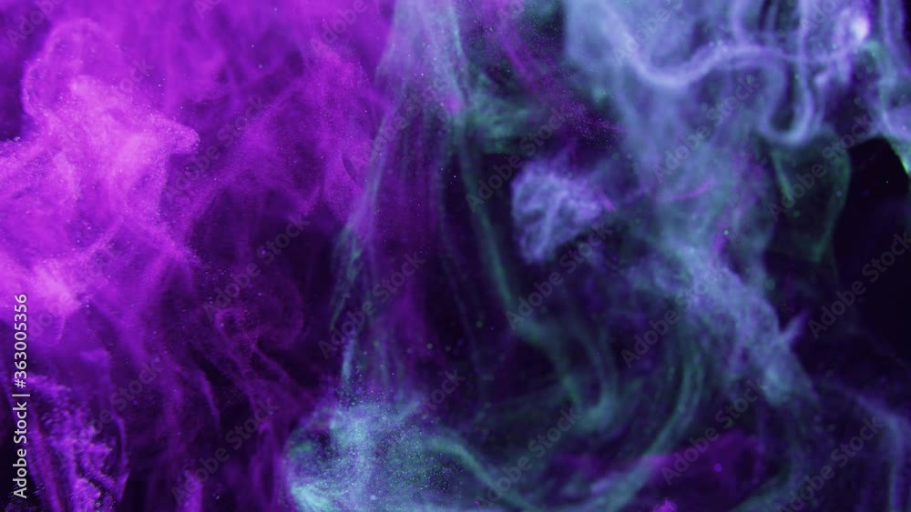 A cloud of pink and blue particles moving on black background. Vj, vlogger and music video abstract motion art concepts. A cloud of pink and blue particles moving on black background. Vj, vlogger and music video abstract motion art concepts.