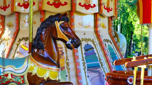 Attraction children's colorful carousel in retro style horse