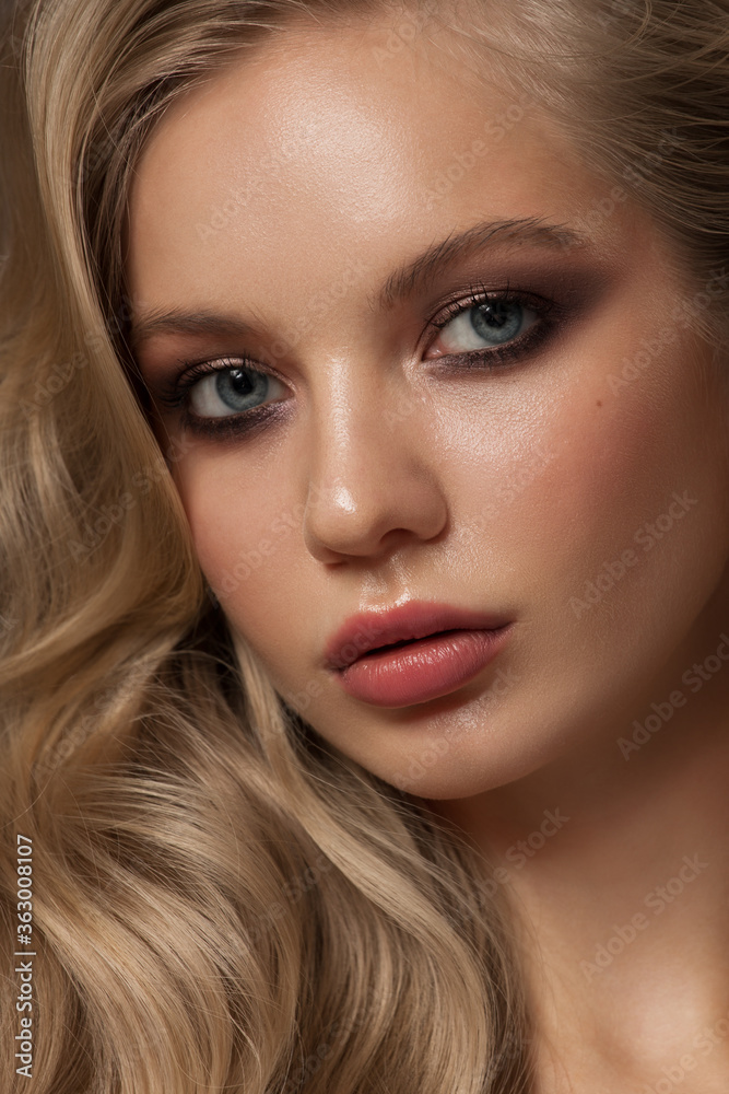 Portrait of a blonde girl with long beautiful wavy hair Portrait of a blonde girl with long beautiful wavy hair
