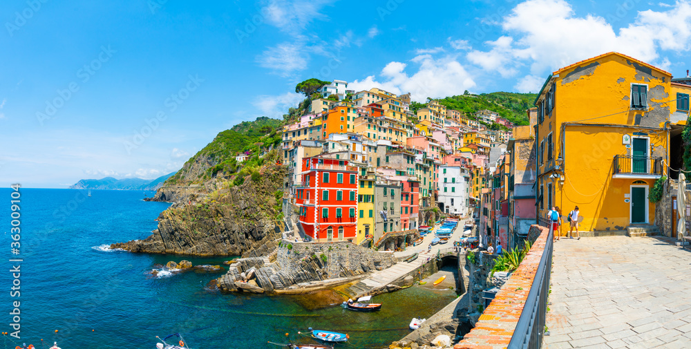 Cinque Terre, Italy - july 1st 2020 - Overview of the village Riomaggiore with a very quiet square due to Corona, one of the towns known as Cinque Terre