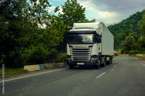 truck driving on a road.