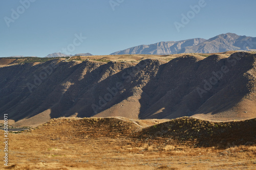 view of the Kopetdag mountains and the sun-scorched territory during the summer heat photo