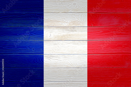 France flag painted on old wood plank background. Brushed wooden board texture. Wooden texture background flag of France.