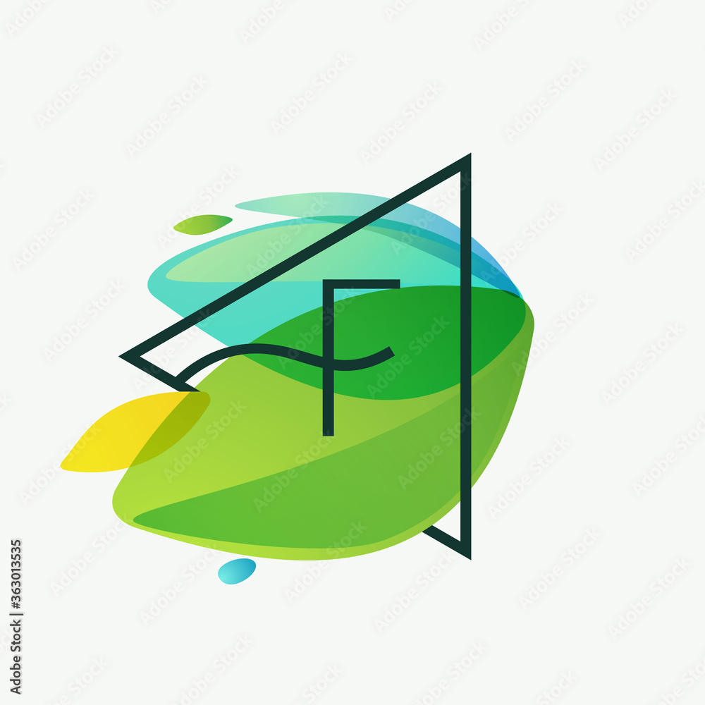 F letter logo in triangle frame at green leaves watercolor background. F letter logo in triangle frame at green leaves watercolor background.